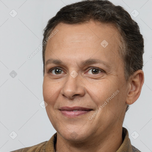 Joyful white adult male with short  brown hair and brown eyes