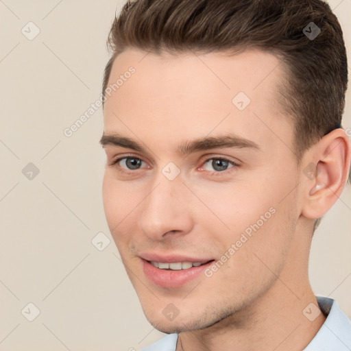 Joyful white young-adult male with short  brown hair and brown eyes