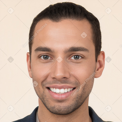 Joyful white young-adult male with short  brown hair and brown eyes