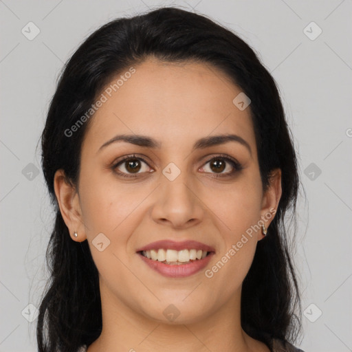 Joyful latino young-adult female with long  brown hair and brown eyes