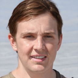 Joyful white adult male with short  brown hair and grey eyes