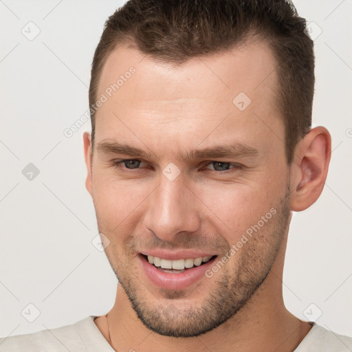 Joyful white young-adult male with short  brown hair and brown eyes