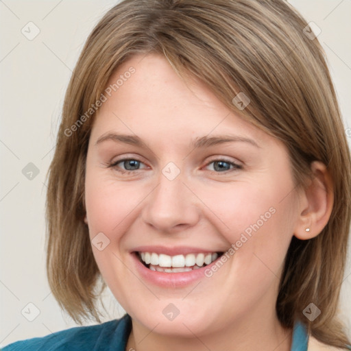 Joyful white young-adult female with medium  brown hair and blue eyes