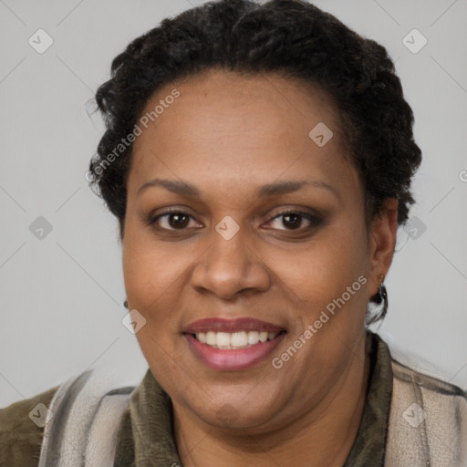 Joyful black adult female with short  brown hair and brown eyes