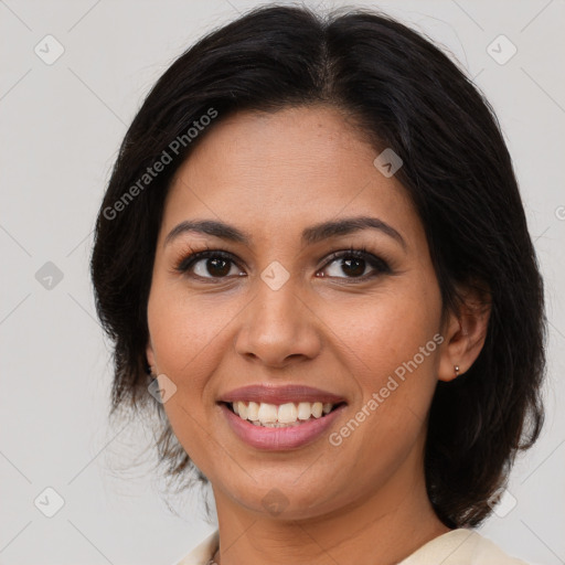 Joyful latino young-adult female with medium  brown hair and brown eyes