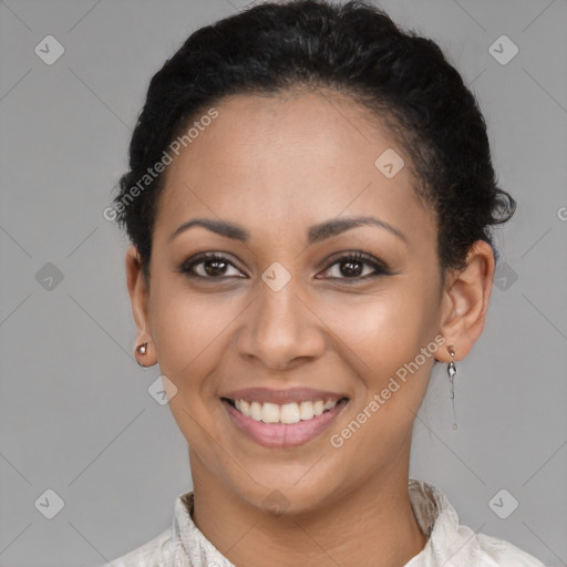 Joyful latino young-adult female with short  black hair and brown eyes