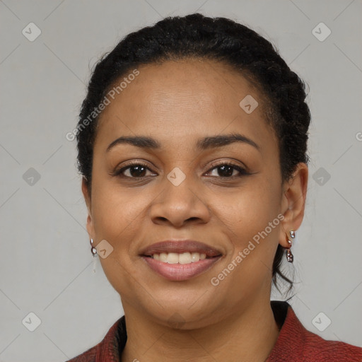 Joyful black young-adult female with short  black hair and brown eyes