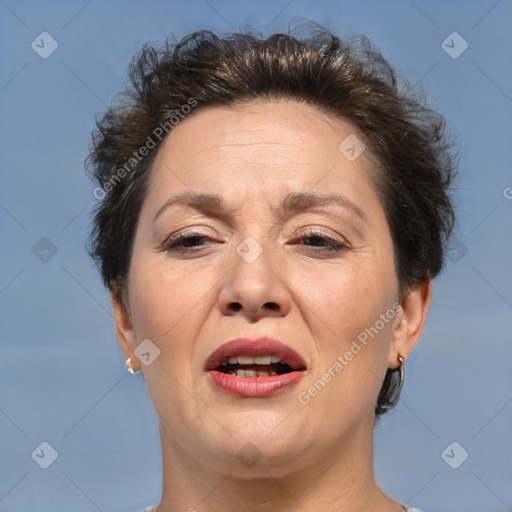 Joyful white adult female with short  brown hair and brown eyes