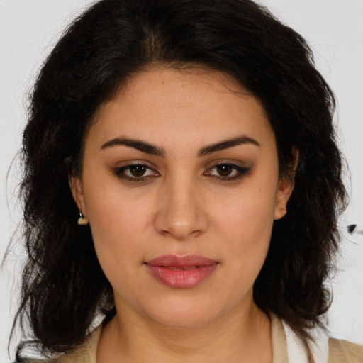Joyful latino young-adult female with medium  brown hair and brown eyes
