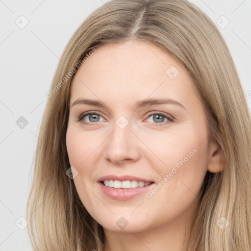 Joyful white young-adult female with long  brown hair and grey eyes