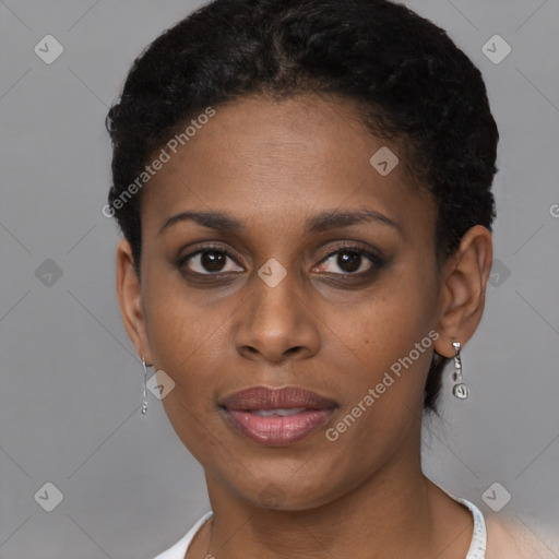Joyful black young-adult female with short  brown hair and brown eyes