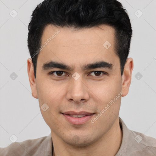 Joyful latino young-adult male with short  black hair and brown eyes