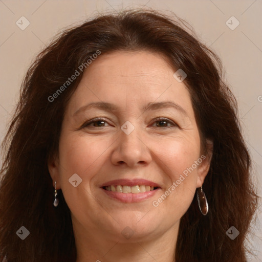 Joyful white adult female with long  brown hair and brown eyes