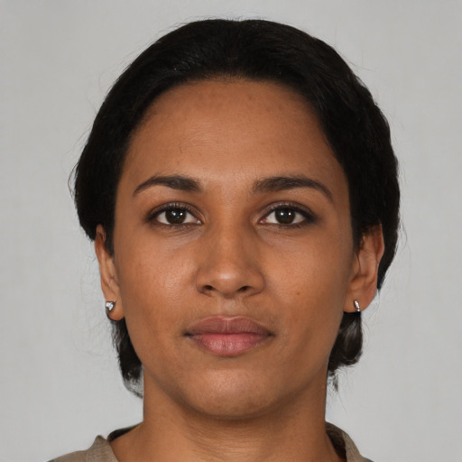 Neutral latino young-adult female with medium  black hair and brown eyes