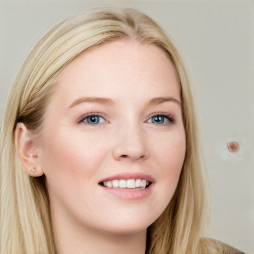 Joyful white young-adult female with long  brown hair and blue eyes