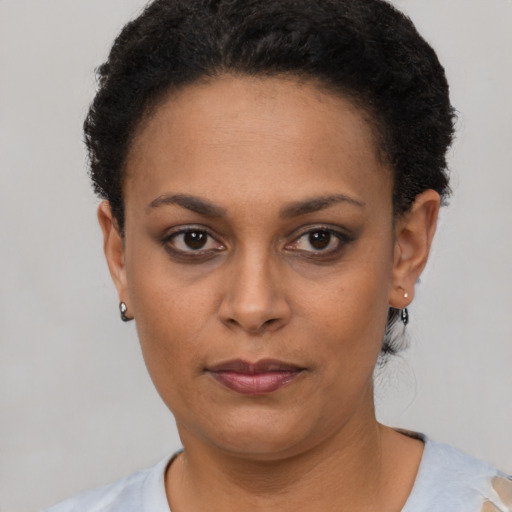 Neutral black young-adult female with short  black hair and brown eyes