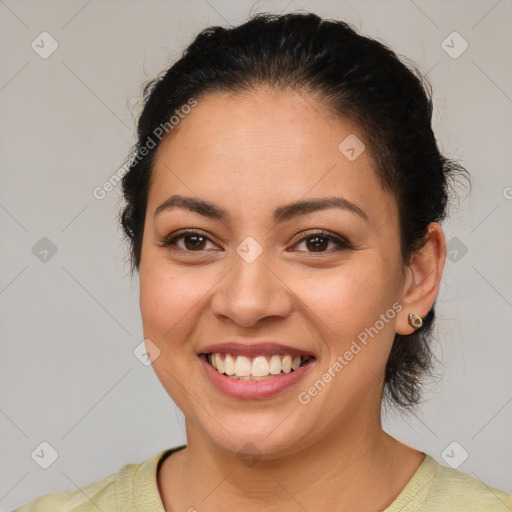 Joyful latino young-adult female with short  brown hair and brown eyes