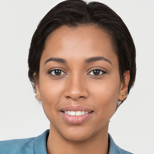 Joyful latino young-adult female with short  brown hair and brown eyes