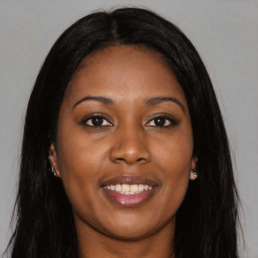 Joyful asian young-adult female with long  black hair and brown eyes