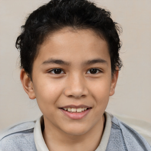 Joyful latino child male with short  brown hair and brown eyes