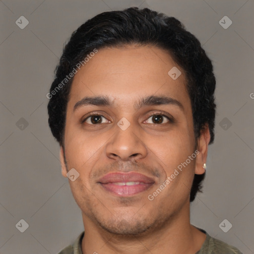 Joyful latino young-adult male with short  black hair and brown eyes