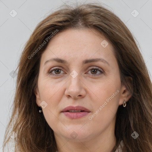 Joyful white adult female with long  brown hair and brown eyes