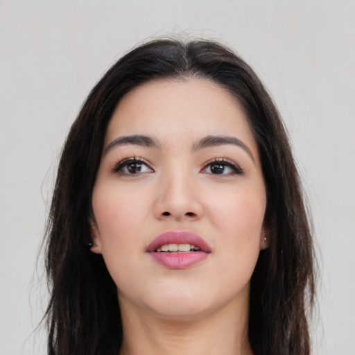 Joyful asian young-adult female with long  brown hair and brown eyes