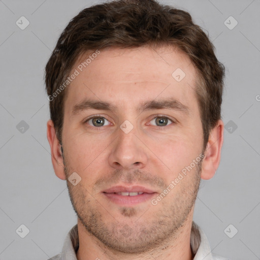 Joyful white young-adult male with short  brown hair and grey eyes