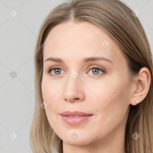 Joyful white young-adult female with long  brown hair and grey eyes