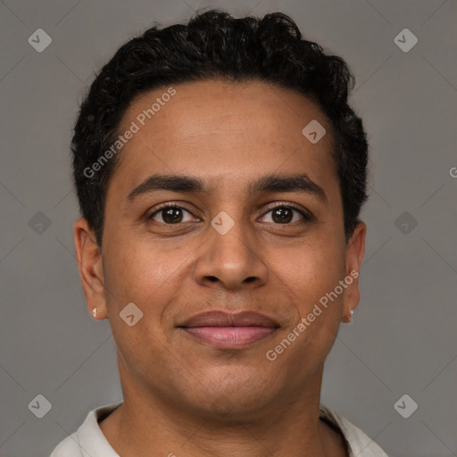 Joyful latino young-adult male with short  brown hair and brown eyes