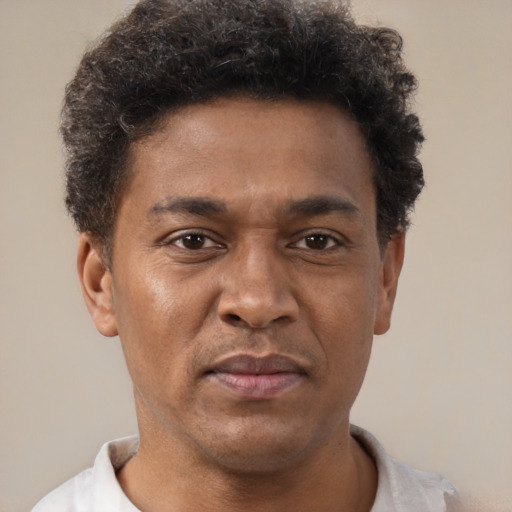 Neutral black adult male with short  brown hair and brown eyes