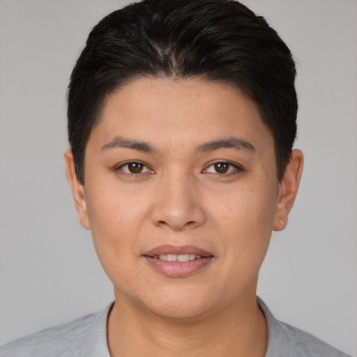 Joyful white young-adult female with short  black hair and brown eyes