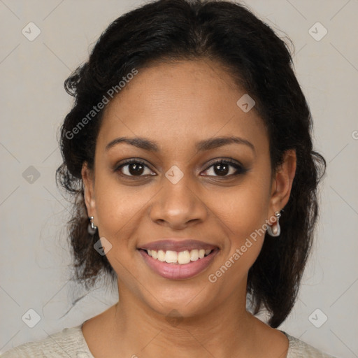 Joyful black young-adult female with medium  brown hair and brown eyes