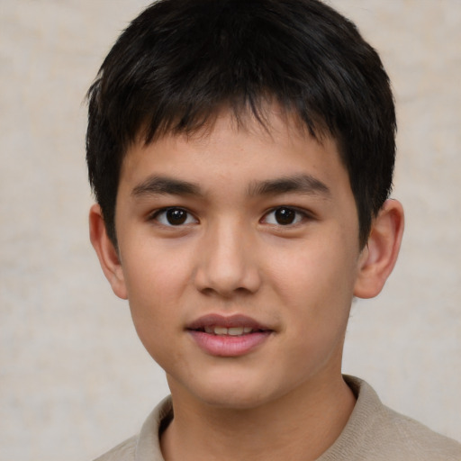 Joyful white child male with short  brown hair and brown eyes
