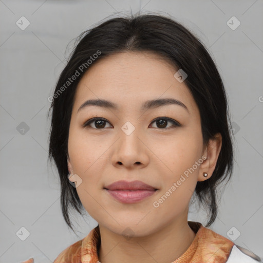 Joyful asian young-adult female with medium  black hair and brown eyes