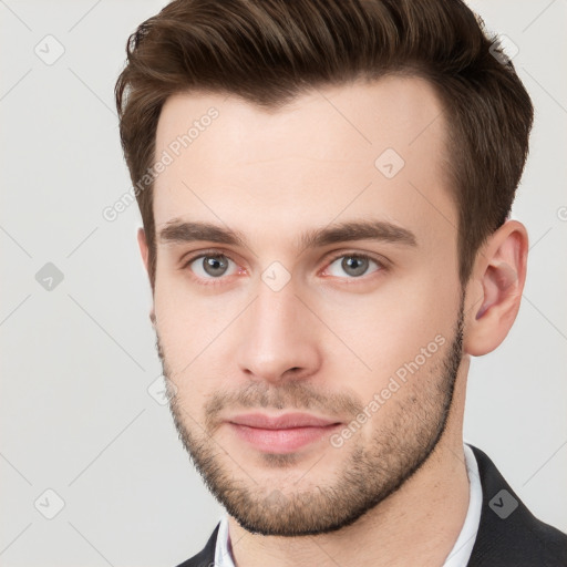 Neutral white young-adult male with short  brown hair and brown eyes