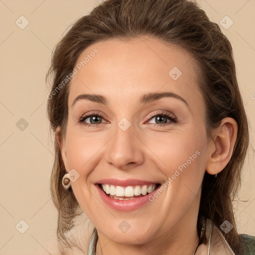 Joyful white young-adult female with medium  brown hair and green eyes