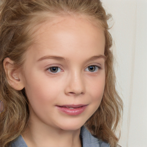 Joyful white child female with medium  brown hair and blue eyes