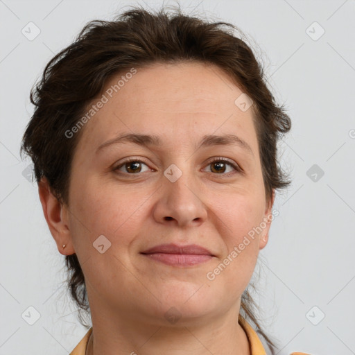 Joyful white adult female with short  brown hair and brown eyes