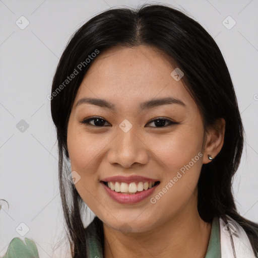 Joyful asian young-adult female with long  brown hair and brown eyes