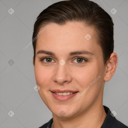 Joyful white young-adult female with short  brown hair and grey eyes