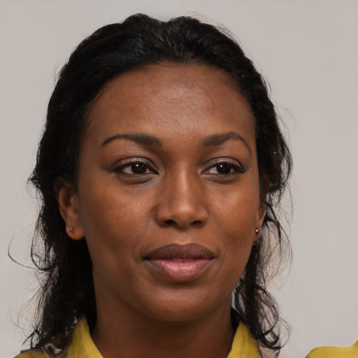 Joyful black young-adult female with medium  brown hair and brown eyes