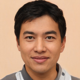 Joyful asian young-adult male with short  black hair and brown eyes