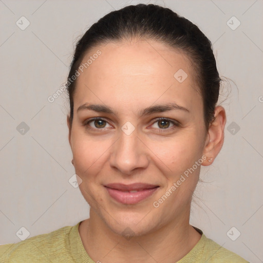 Joyful white young-adult female with short  brown hair and brown eyes