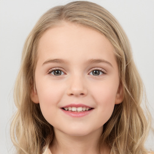 Joyful white child female with medium  brown hair and grey eyes