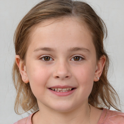 Joyful white child female with medium  brown hair and grey eyes