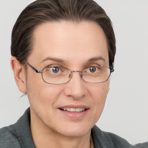 Joyful white adult female with short  brown hair and grey eyes