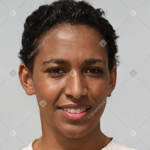 Joyful black adult female with short  brown hair and brown eyes