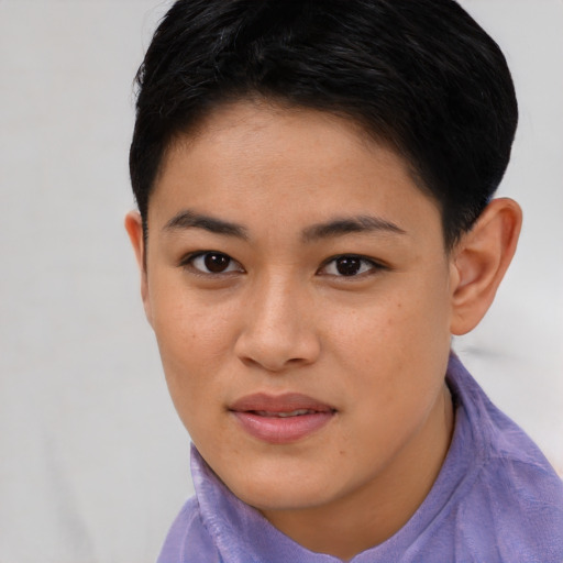 Joyful asian young-adult female with short  brown hair and brown eyes