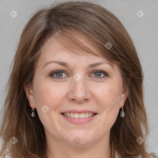 Joyful white adult female with long  brown hair and grey eyes